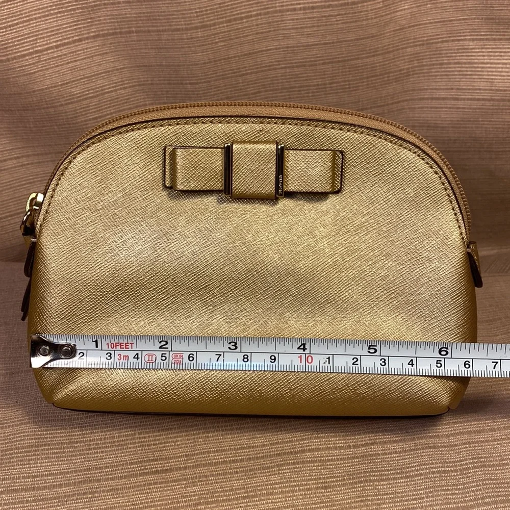 Coach gold metallic color cosmetic pouch w/elegant bow